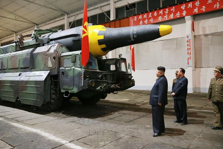 North Korean leader Kim Jong Un checking out a missile after Pyongyang test-fired a new ballistic missile, which it says is capable of carrying a big nuclear warhead, earlier this month.