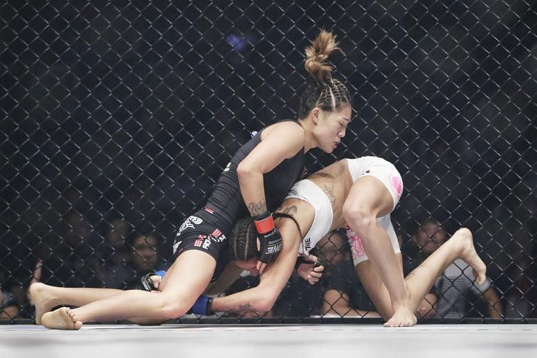 Angela Lee on the way to retaining her One Championship atomweight title against Istela Nunes at the Singapore Indoor Stadium on Friday. She wrapped up the win in the second round with a well-executed submission.