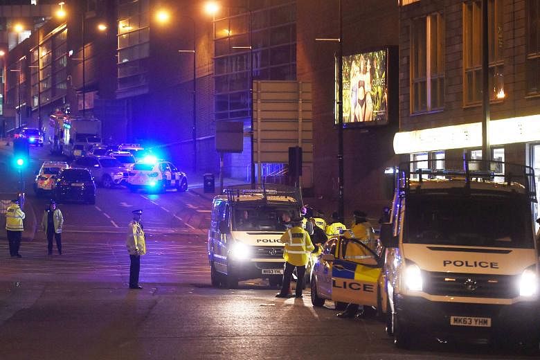 Police at the scene of the recent bombing in Manchester, England. The Singapore Government has constantly stressed the heightened threat levels here as the Republic is a high-value target.