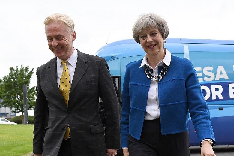 Mrs Theresa May with local Conservative candidate Kevin Horkin as she arrived in the constituency of Hyndburn in Accrington, Lancashire county on Tuesday.
