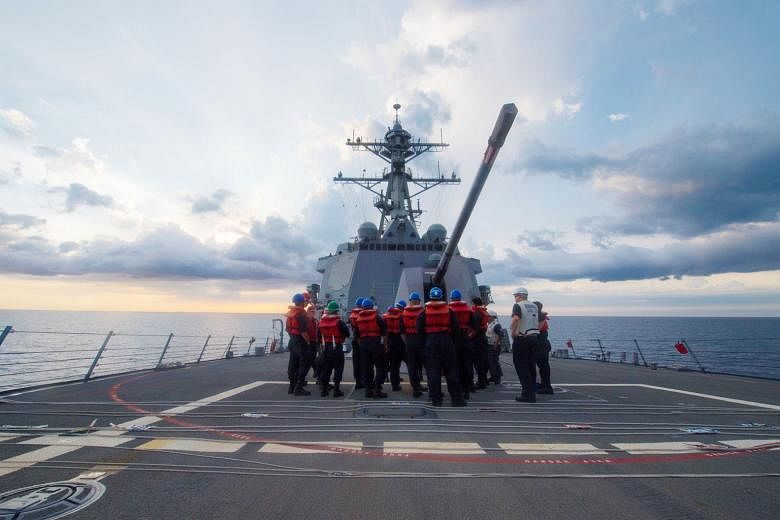 The USS Dewey in the South China Sea last month. A US official said the USS Dewey last week "engaged in normal operations by conducting a manoeuvring drill inside 12 nautical miles of Mischief Reef".