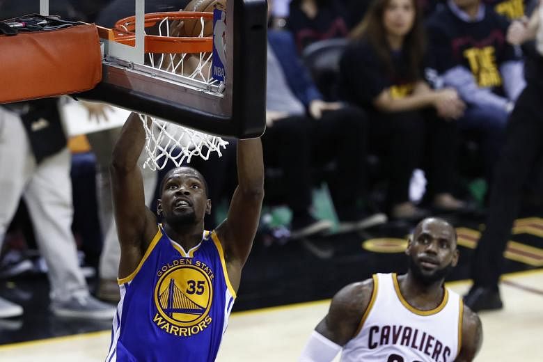 Golden State's Kevin Durant goes for a dunk as LeBron James can only look on during Game Three. Durant has had the upper hand in their duels, and can seal a first NBA championship with a win today.