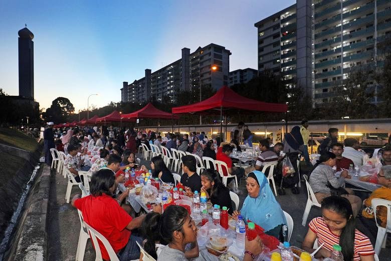 About 4,000 residents breaking fast together at a special event at Marsiling Mega Sports Park on June 4.