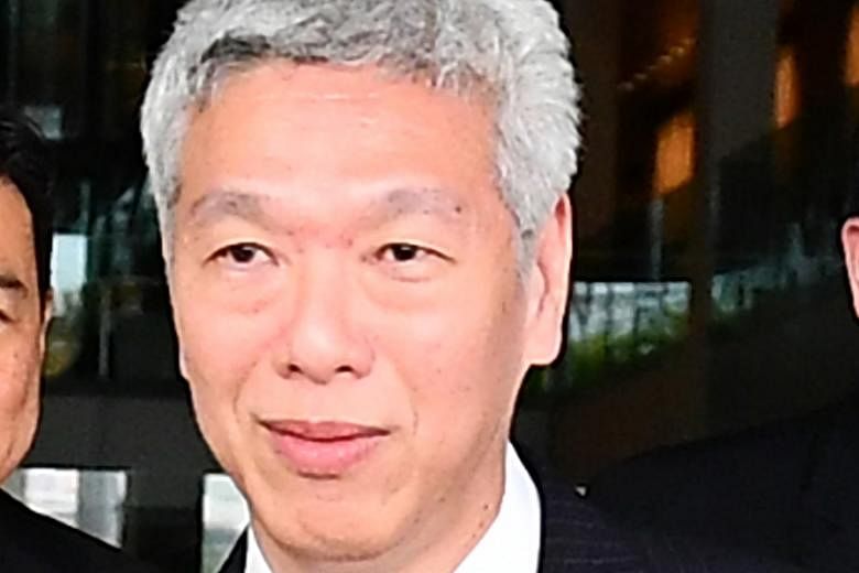 Prime Minister Lee Hsien Loong said Mr Lee Hsien Yang (left) and Dr Lee Wei Ling threatened to escalate their attacks against him during the GE.