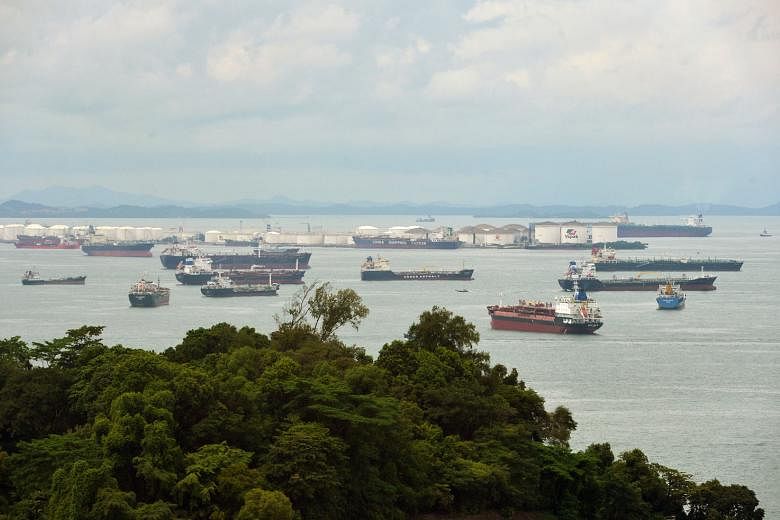 Oil tankers in front of Pulau Sebarok, an oil storage and refuelling port among the southern islands of Singapore. Brokers say around 10 VLCCs have been chartered since the end of last month to store crude for periods ranging from 30 days to around s