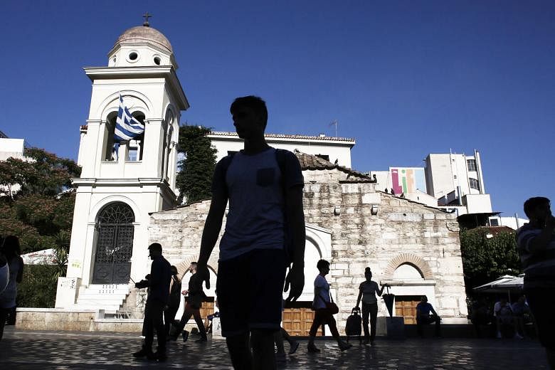 Greece's creditors on Thursday agreed to release new loans for Athens, capping a key chapter of the country's bailout and ending months of uncertainty over whether it could meet large bond payments due next month. But it was not enough to get the IMF