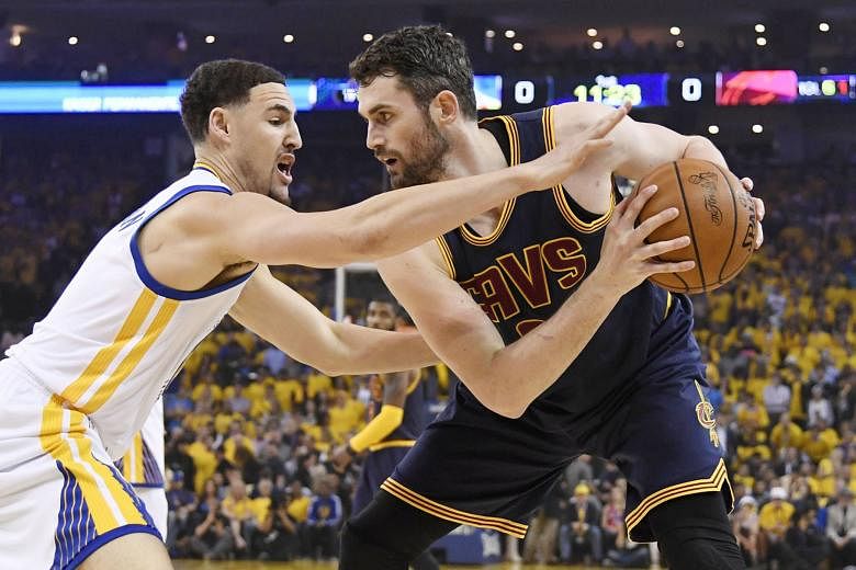 Cleveland Cavaliers forward Kevin Love is guarded by Golden State Warriors' Klay Thompson during the recent NBA Finals. The Cavs are likely to look at the possibility of trading Love.