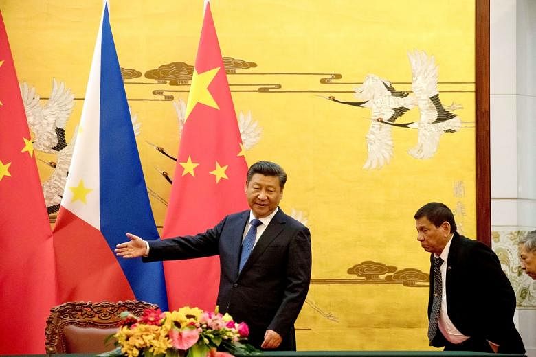 Chinese President Xi Jinping showing Philippine President Rodrigo Duterte the way at a signing ceremony in Beijing in October last year. President Duterte's rapprochement with China is faltering: Chinese capital has not poured into the Philippines, n