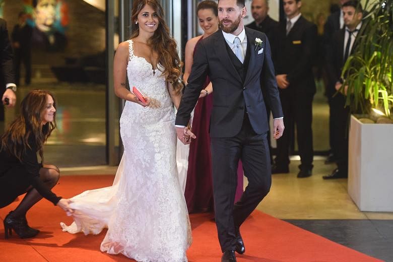 Football star Lionel Messi and bride Antonella Roccuzzo just after their wedding ceremony at the City Centre casino in Rosario, Argentina on Friday. The couple's children Thiago, four, and Mateo, one, had front-row seats at the "wedding of the centur