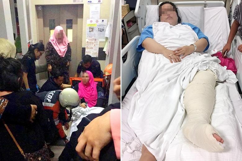 The victim was with her husband, daughter, brother and brother-in-law during a Hari Raya visit when the lift plunged, fracturing her leg. (Left) Singapore Civil Defence Force officers helping her after the accident last Saturday.