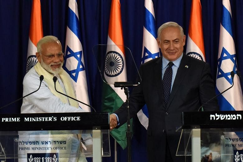 Indian Prime Minister Narendra Modi with his Israeli counterpart Benjamin Netanyahu in Jerusalem on Tuesday. Mr Modi has been accorded a warm welcome in Israel, which is keen to woo the economic powerhouse.