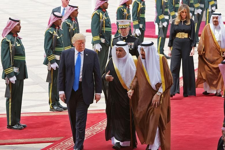 US President Donald Trump being welcomed by Saudi King Salman bin Abdulaziz al-Saud (right) at King Khalid International Airport in Riyadh on May 20. The writer says there was a palpable sense of relief when Mr Trump went to Riyadh. The US was back. 
