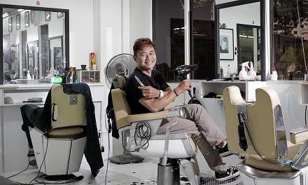 Mr Juffri Hanan, a Malay barber who owns a shop at Rivervale Plaza in Sengkang, goes to various secondary schools to cut students’ hair on the request of their discipline masters. -- ST PHOTO: NEO XIAOBIN