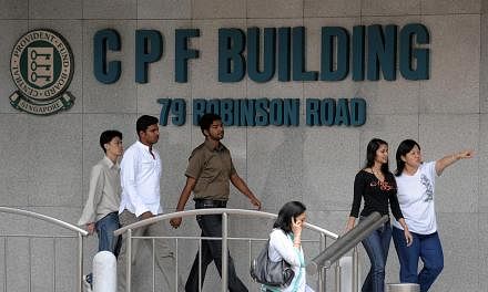 Workers outside CPF Building. CPF members will continue to get a 2.5 per cent interest rate on their on Ordinary Accounts (OA) from Oct 1 to Dec 31 this year. -- ST FILE PHOTO: CAROLINE CHIA