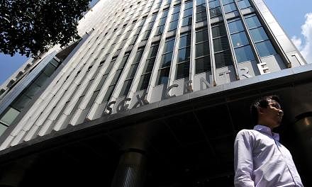 A man walks past the Singapore Exchange building at Shenton Way. Share trading in Singapore could be headed for some major changes in the wake of last October's penny stock crash if new proposals by regulators go ahead. -- ST FILE PHOTO: KUA CHEE SIO