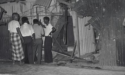 A mother and her daughter were killed and six others injured when a bomb exploded in Jalan Rebong on April 13, 1964. Three days later, another bomb went off about a kilometre away. -- ST FILE PHOTO