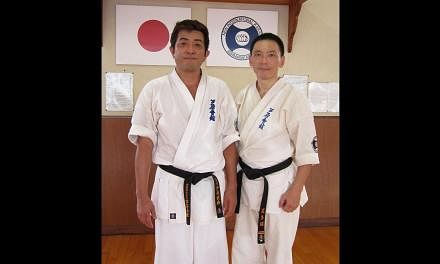 Mr James Goh (right) enjoys learning from Mr Hidenori Ashihara (left), head of Ashihara Karate Kaikan on Matsuyama island in Japan. -- PHOTO: COURTESY OF JAMES GOH