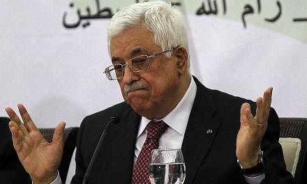 Palestinian Authority President Mahmud Abbas gestures as he gives a speech during a meeting with the Palestine Liberation Organisation (PLO)'s Central Council in the West Bank city of Ramallah on April 26, 2014. -- FILE PHOTO: AFP