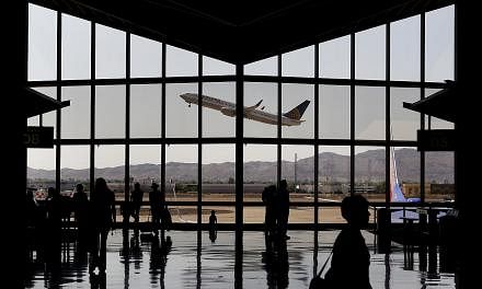 The fear of flying affects up to 30 per cent of people, but a severe phobia to the extent of avoiding air travel completely affects only 2 to 3 per cent of the population. -- PHOTO: BLOOMBERG