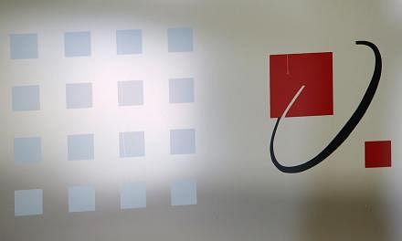 A SingTel signage is pictured at their head office in Singapore on May 15, 2014. -- PHOTO: REUTERS