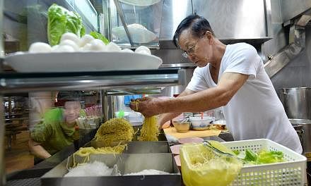 All the action happens before 11am at this stall (above), which sells fishball noodles and mushroom minced pork noodles -- PHOTO: LIM YAOHUI FOR THE STRAITS TIMES