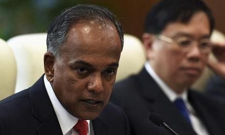 Singapore's Foreign Minister K. Shanmugam speaks during a meeting with China's Foreign Minister Wang Yi (not pictured) in Beijing on June 12, 2014. -- PHOTO: REUTERS