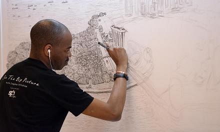 British artist Stephen Wiltshire (left) starting on his sketch of the Singapore cityscape at Paragon yesterday as members of the public watched him work. The first thing he drew on the 4m by 1m canvas was the outline of the iconic Marina Bay Sands (a