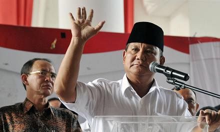 Indonesian presidential candidate Prabowo Subianto delivers his statement prior to the election count announcement in Jakarta on July 22, 2014. -- PHOTO: AFP