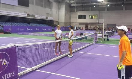 Grand Slam champion Iva Majoli (right) with&nbsp;American 70th seed Shelby Rogers (left). -- ST PHOTO: Daryl Chin