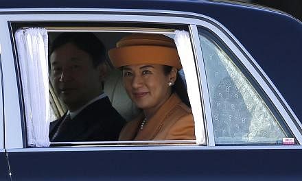 Japan's Crown Princess Masako (right) and Crown Prince Naruhito leave a welcoming ceremony for King Willem Alexander and Queen Maxima of the Netherlands at the Imperial Palace in Tokyo on Oct 29, 2014. King Willem Alexander and Queen Maxima are in Ja