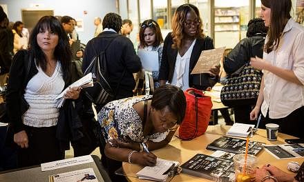 A jobs fair at the Bronx Public Library on Sept 17, 2014, in the Bronx Borough of New York City. -- PHOTO: AFP