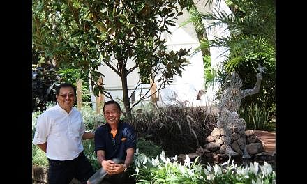 Award-winning duo John Tan (left) and Raymond Toh (right) at the Gardening World Cup in Japan last year.
