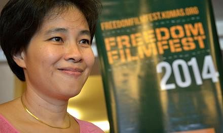 Director Tan Pin Pin at the screening of her film To Singapore With Love, at the Freedom Film Fest in Johor Baru on Sept 19, 2014. The show was given a “Not Allowed for All Ratings” classification by the MDA in Singapore. -- ST PHOTO: KUA CHEE SI