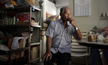 Mr Chu Yok Choon sits in his bicycle rental shop at Pulau Ubin. -- ST PHOTO: DESMOND LIM