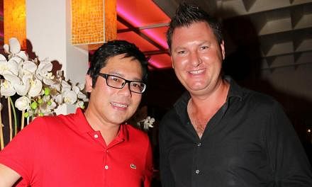 Group chief executive Sean Lee (with a friend, Australian landscape architect Anton Joel Clark) is intrigued by Bali’s culture and traditions. --&nbsp;PHOTO: COURTESY OF SEAN LEE