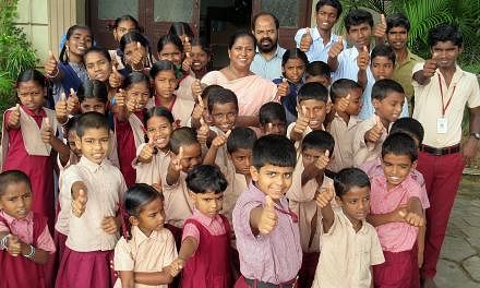 When he lost his three children to the tsunami on what was his 40th birthday, engineer K Parameswaran (in blue shirt) and wife Choodamani (in peach sari) opened their large home to children orphaned by the hungry tide. They now have 37 wards, includi