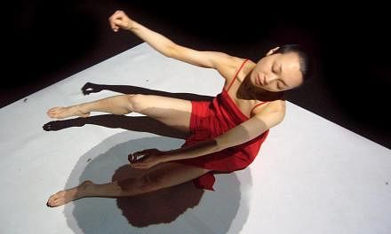 Loss-Layers, by France-based collective A.lter S.essio, features solo performer Yum Keiko Takayama dancing with projections illustrated by Matthieu Levet and Cecile Attagnant. -- PHOTO:&nbsp;FABRICE PLANQUETTE