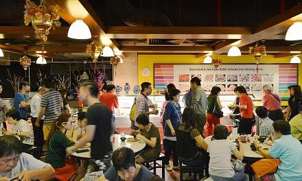 The crowds have returned to Chinese restaurant Hotpot Culture, which was suspended last month after a dead rat was found in a salted vegetable dish. The restaurant held an open house on Friday, giving out free food to customers. -- ST PHOTO: ALPHONSU