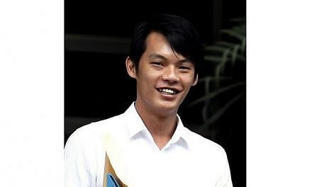 Ng Shi Qiang, 31, was jailed for five years and nine months and ordered to be given six strokes of the cane, after pleading guilty to having unlawful possession of a Beretta pistol. -- ST PHOTO: WONG KWAI CHOW