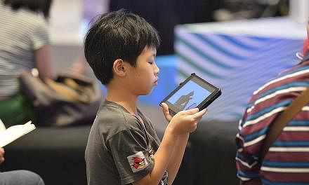 A child using an iPad. -- PHOTO: ST FILE