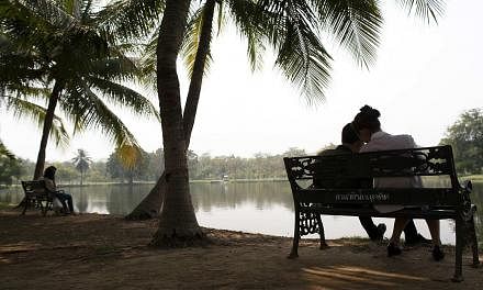 Couples at a park in Bangkok on Feb 11, 2015. -- PHOTO: REUTERS
