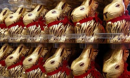 Gold-wrapped Easter chocolate bunnies are displayed during the annual news conference of Swiss chocolatier Lindt &amp; Spruengli in Kilchberg near Zurich on March 10, 2015. --PHOTO: REUTERS