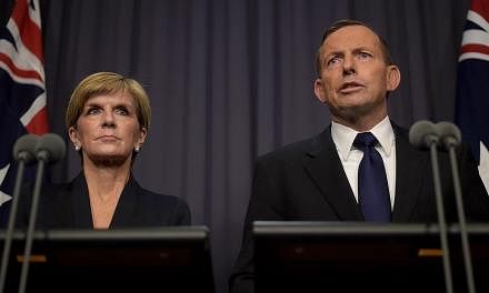 Australian Prime Minister Tony Abbott (right) and Australian Foreign Minister Julie Bishop speaking to the media at Parliament House in Canberra, Australia on April 29, 2015. -- PHOTO: EPA