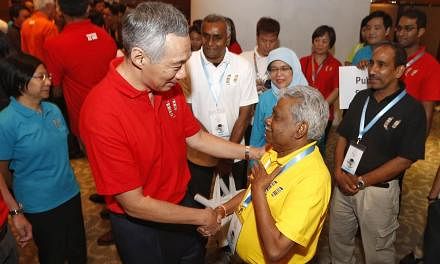 Prime Minister Lee Hsien Loong meeting trade unionist G Muthukumarasamy (second, right) after the May Day celebration. Recalling the euologies shared by unionists and tripartite partners at the labour movement's tribute event for Mr Lee, PM Lee also 