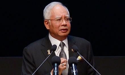 Malaysian Prime Minister Datuk Seri Najib Razak faces a test of his popularity this week in two by-elections that come hard on the heels of calls by the country's former long-time leader, Tun Dr Mahathir Mohamad, for him to step down. -- PHOTO: AFP