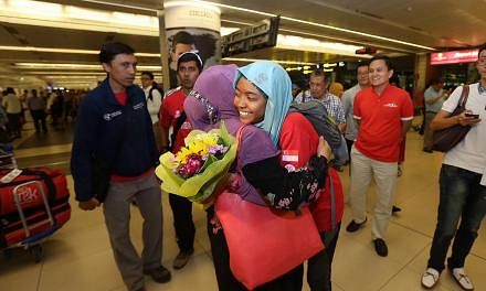 The remaining three team members, Ismail Latiff, Nur Yusrina Yaakob and Zulkifli Latiff have safely descended from Everest Base Camp and arrived in Singapore at Changi Airport Terminal 2 on May 4, 2015. They landed in Singapore at 8:10pm. -- ST PHOTO