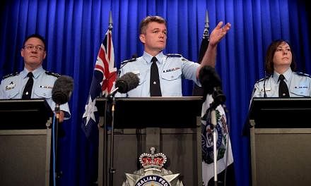 (Left to right) Australian Federal Police (AFP) Deputy Commissioner Michael Phelan, AFP Commissioner Andrew Colvin and Deputy Commissioner Leanne Close speak to the media during a press conference in Canberra, Australia, on May 4, 2015. -- PHOTO: EPA