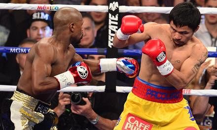 Boxer and politician Manny Pacquiao, 36, is expected to donate half of his earnings from Saturday's boxing match with Floyd Mayweather Jr to charity. --PHOTO: AFP