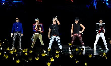 Members of BigBang, (from left) T.O.P, G-Dragon, Taeyang, Daesung and Seungri, during the band's concert BigBang Alive Galaxy Tour at the Singapore Indoor Stadium on Sept 28, 2012.&nbsp;-- PHOTO: YG ENTERTAINMENT