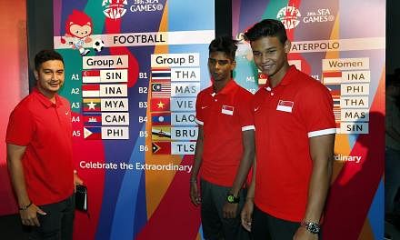 (From left) National Under-23 coach Aide Iskandar with players Iqbal Hussain and Irfan Fandi at the draw conducted on 15 April 2015 for the June SEA Games. The Lions will begin their SEA Games football campaign on June 1 against the Philippines. -- S